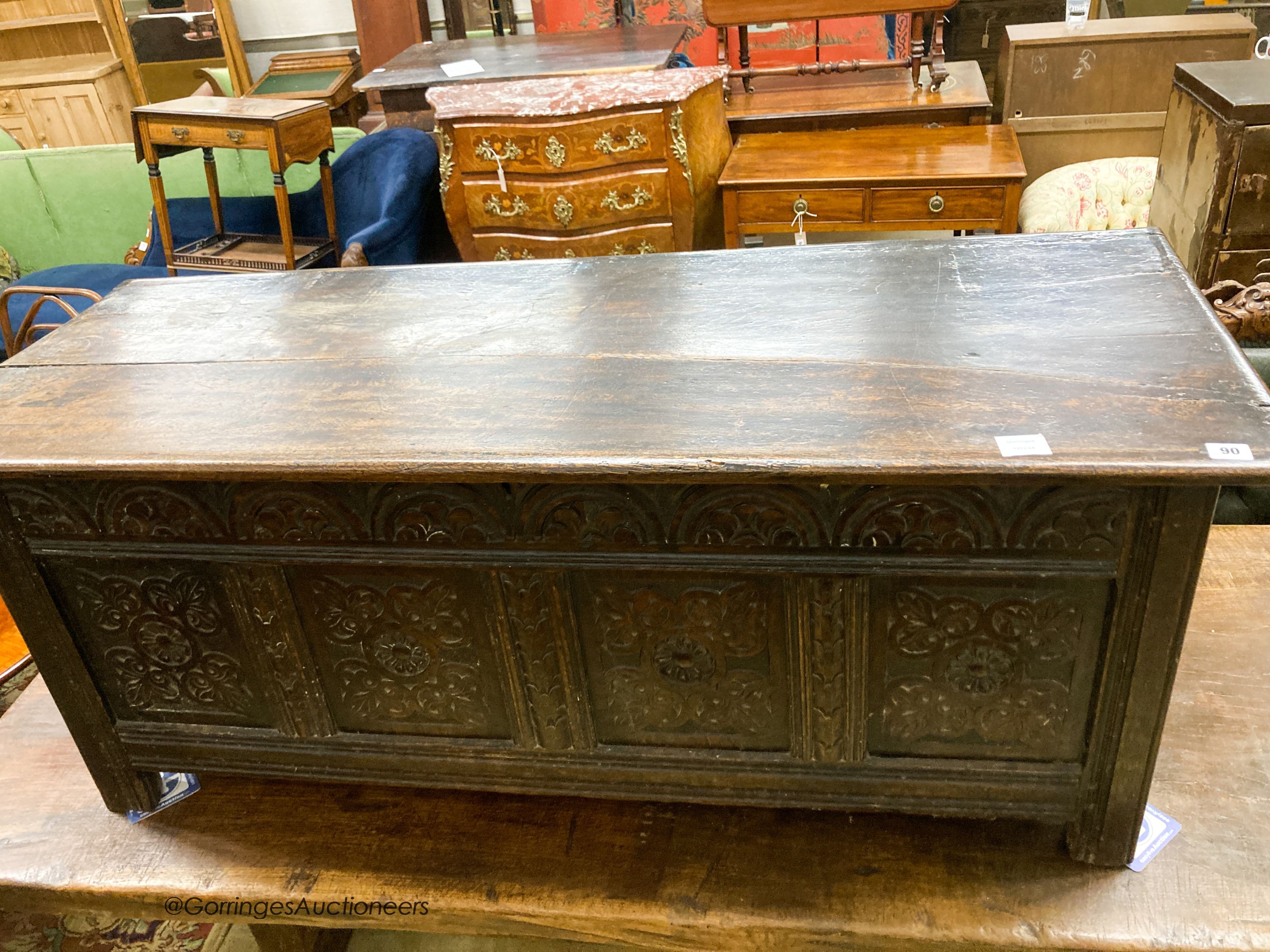 A 17th century carved oak coffer, length 140cm, depth 53cm, height 58cm